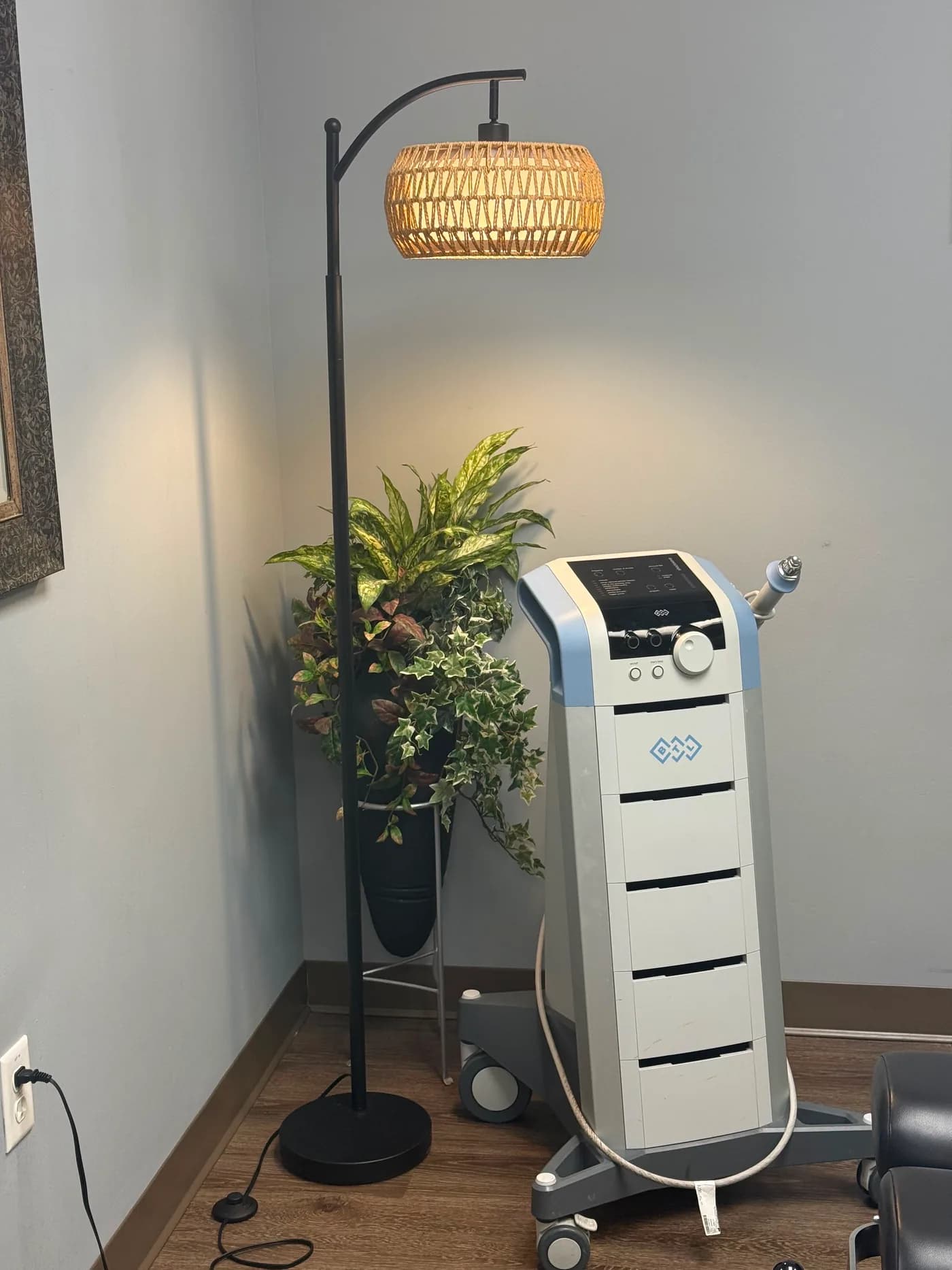Radial shockwave therapy equipment in a Planet Health Care treatment room